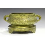 A Chinese engraved bronze bombé censer and stand, mark of Xuande but late Qing/early 20th century,