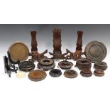 A collection of Chinese hardwood stands, late 19th century and later, including a pair of dish