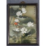 A Chinese reverse painting on glass, 20th century, depicting a pair of mandarin ducks on a lily