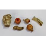 A group of five Chinese Canton carved and stained models of fruit and a nut, late Qing dynasty,