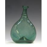 A Persian green glass saddle flask, 18th/19th century, of flattened form, the narrow neck with