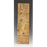 A South-east Asian carved wood rectangular panel, carved in relief with a full-length figure above a