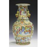 A Chinese Canton famille rose porcelain vase, mid-19th century, the ovoid body and flared neck