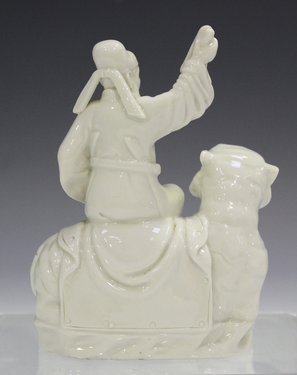 A Chinese blanc-de-Chine figure group, 20th century, modelled as an immortal seated on the back of a - Image 8 of 9