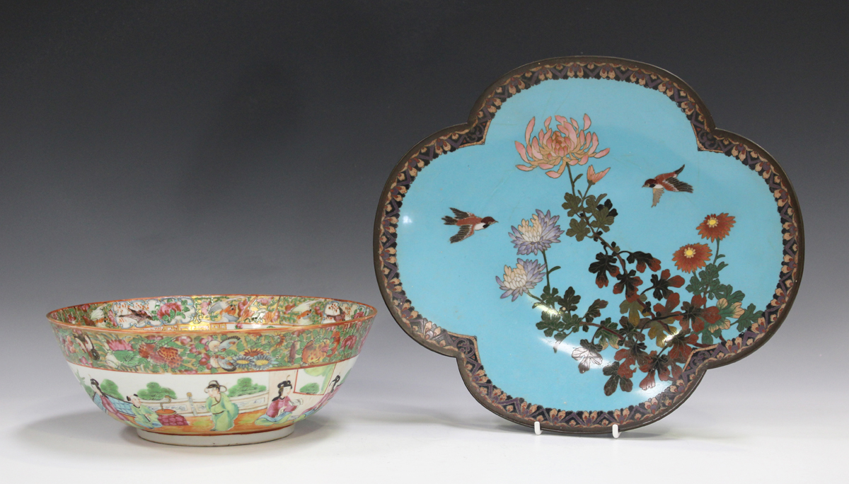 A Japanese cloisonné lobed oval dish, Meiji period, decorated with two birds flying above peonies