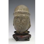 A South-east Asian carved stone Buddha head fragment, probably Vietnamese, possibly 17th century,