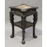 A Chinese hardwood two-tier stand, late Qing dynasty, the top inset with a rouge marble panel within