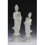 Two Chinese blanc-de-Chine figures of Guanyin, 20th century, each modelled standing and holding a