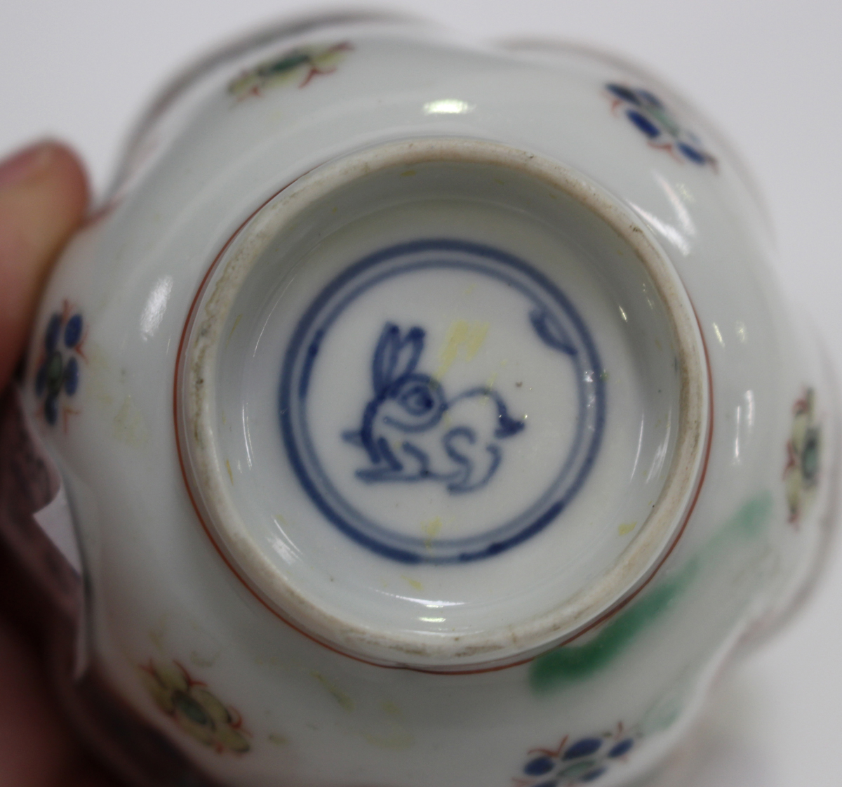 A small group of Chinese export porcelain, 18th century, including a 'clobbered' blue and white - Image 2 of 20