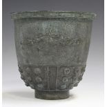 A Chinese archaistic green patinated bronze pot, 20th century, the U-shaped body with keyfret rim,