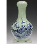 A Chinese blue and white celadon ground porcelain bottle vase, early 20th century, the onion mouth