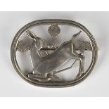 A Georg Jensen sterling silver brooch, designed by Arno Malinowski as a deer with stylized flowers