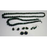 Three pairs of gold mounted malachite earclips, detailed '14K 585', two single row necklaces of