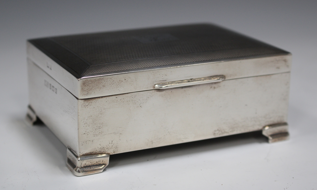An Elizabeth II silver cigarette box with engine turned hinged lid, Birmingham 1958, length 11.2cm.