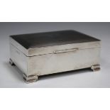 An Elizabeth II silver cigarette box with engine turned hinged lid, Birmingham 1958, length 11.2cm.