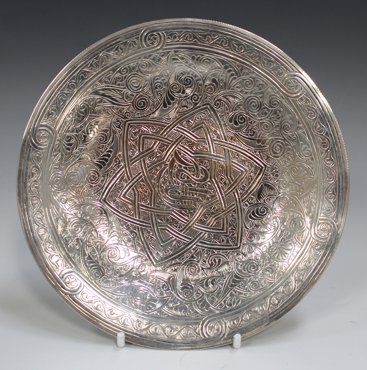 An Egyptian silver circular dish, engraved with a central script and star motif within foliate - Image 3 of 5