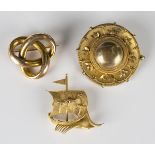 A gold brooch in a trefoil design, width 2.7cm, a Victorian locket brooch of circular form,