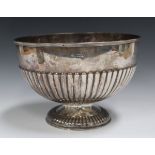 A George V silver rose bowl with half-reeded body and domed foot, London 1910 by William Hutton &