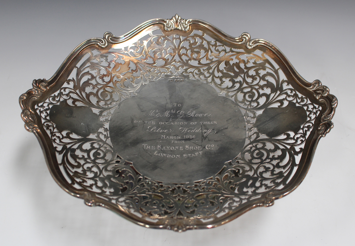 A George V silver footed dish with cast scroll rim and pierced border framing an engraved - Image 4 of 4