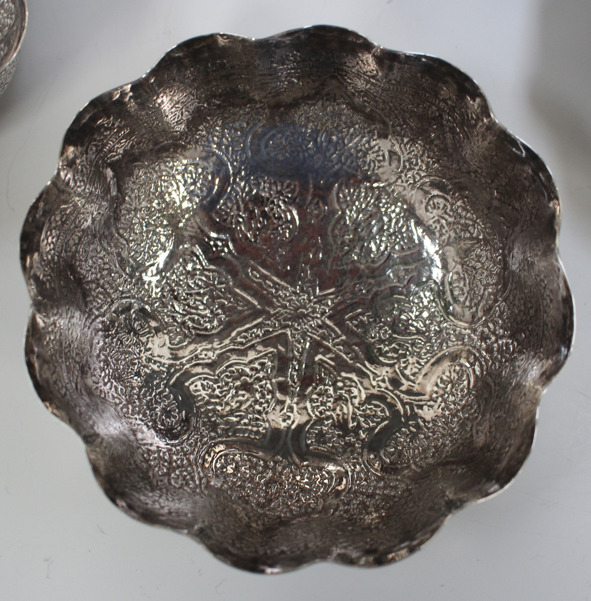 An Egyptian silver circular dish, engraved with a central script and star motif within foliate - Image 5 of 5