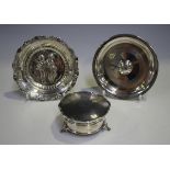A late 19th century Continental silver circular dish, cast in relief with two children, import