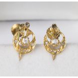 A pair of gold and rose cut diamond earrings, each in an oval openwork design, with screw