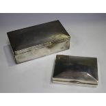 A George V silver rectangular cigarette box, the hinged lid with engine turned decoration,
