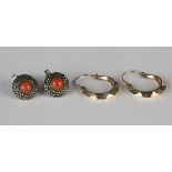 A pair of gold earrings of faceted crescent form, detailed '9ct', a pair of coral and marcasite