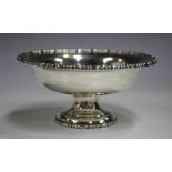 An Edwardian silver pedestal bowl with egg and bead rims, London 1904 by John Byrne & Son Ltd,