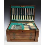 A George V canteen of silver St James pattern cutlery, comprising twelve bone handled table knives