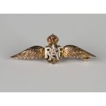 A gold, red, white and green enamelled brooch, pre-1953, designed as the RAF wings, width 3.5cm.