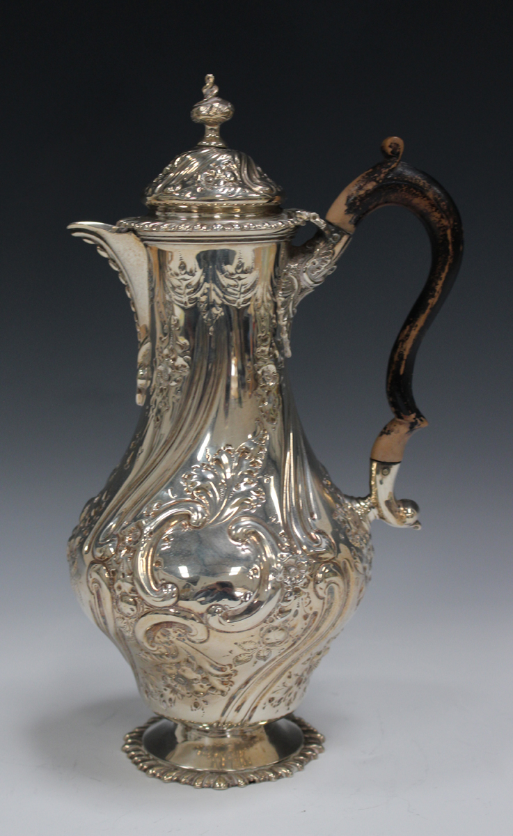 A late Victorian silver hot water jug of baluster form with domed hinged lid and finial, decorated - Image 3 of 4