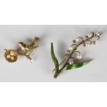 A 9ct gold and cultured pearl brooch, designed as a bird perched on a branch next to a nest, width