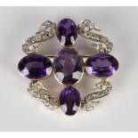 An amethyst and rose cut diamond brooch, mounted with five oval cut amethysts spaced with four