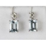 A pair of white gold, aquamarine and diamond pendant earrings, each drop claw set with a rectangular