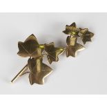 A 9ct gold brooch, designed as a stem of ivy leaves, detailed 'Ivan Tarrant Eng', Birmingham 1962,