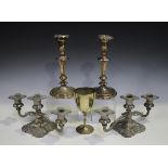 A pair of 19th century Sheffield plate candlesticks with foliate nozzles, height 24cm, and a small