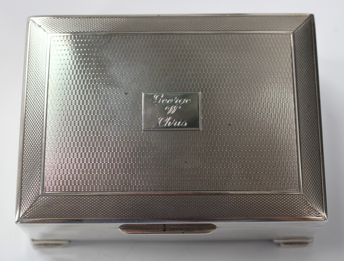 An Elizabeth II silver cigarette box with engine turned hinged lid, Birmingham 1958, length 11.2cm. - Image 4 of 4