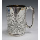 An Edwardian silver christening tankard, engraved with foliage framing a presentation inscription,