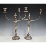 A pair of early 19th century Sheffield plate three-light twin-branch candelabra by Matthew