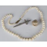A single row necklace of graduated cultured pearls on a 9ct gold clasp, formed as a tied ribbon bow,