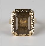 A gold ring, claw set with a cut cornered rectangular step cut smoky quartz, detailed '18K', ring