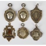 A 9ct gold and enamelled fob medal, Birmingham 1905, and five silver fob medals.Buyer’s Premium 29.