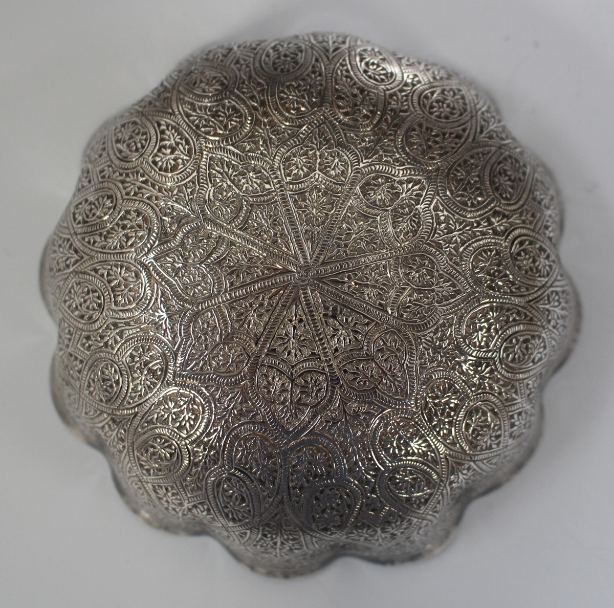 An Egyptian silver circular dish, engraved with a central script and star motif within foliate - Image 4 of 5