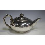 A William IV silver teapot of squat circular form, engraved with a horse crest, London 1831 by