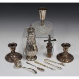 A late Victorian silver sugar caster with pierced dome cover and turned finial, the baluster body
