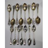 A small collection of silver cutlery, including a set of eight George V dessert spoons with