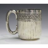 An Edwardian silver christening cup with fluting beneath a foliate band, Sheffield 1909 by James