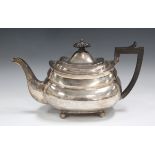 A George III silver teapot of cushion form, on ball feet, London 1814 by Samuel Godbehere & James