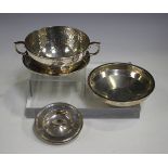 An Edwardian silver two-handled bowl and stand with hammered decoration, Birmingham 1906 by